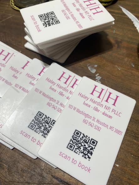 Custom branded promotional products including pens and keychains for marketing